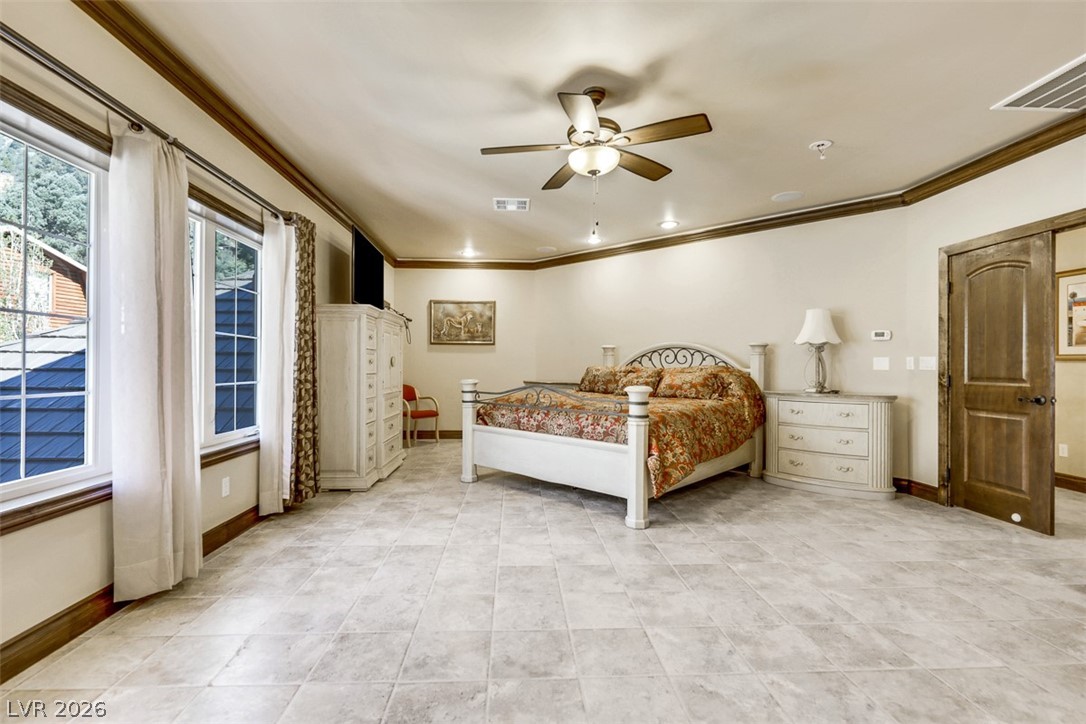 264 Crestview Drive Mount Charleston, NV 89124 - Photo 53 of 78 This primary bedroom offers ample space, tiled flooring, and plenty of natural light.