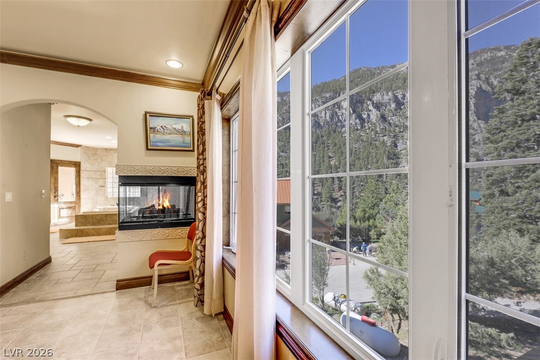 264 Crestview Drive Mount Charleston, NV 89124 - Photo 55 of 78 This exquisite interior space features a fireplace and offers breathtaking mountain views.