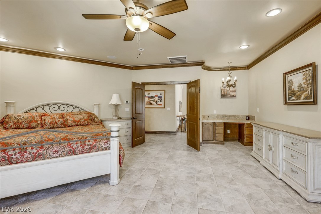 264 Crestview Drive Mount Charleston, NV 89124 - Photo 56 of 78 This spacious bedroom features elegant crown molding and durable tile flooring, perfect for comfortable living.