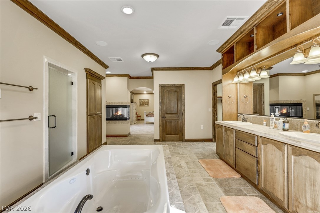 264 Crestview Drive Mount Charleston, NV 89124 - Photo 59 of 78 This spacious bathroom boasts a deep soaking tub and a walk-in shower for ultimate relaxation.
