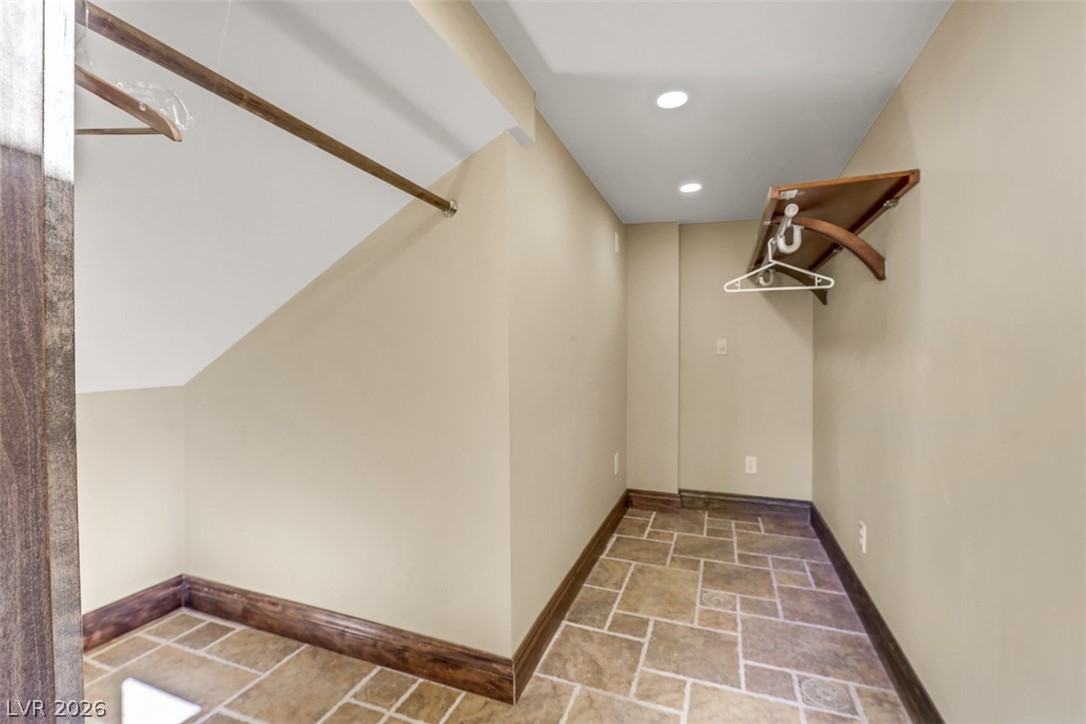 264 Crestview Drive Mount Charleston, NV 89124 - Photo 61 of 78 This spacious closet offers ample storage and features recessed lighting, enhancing functionality and design.