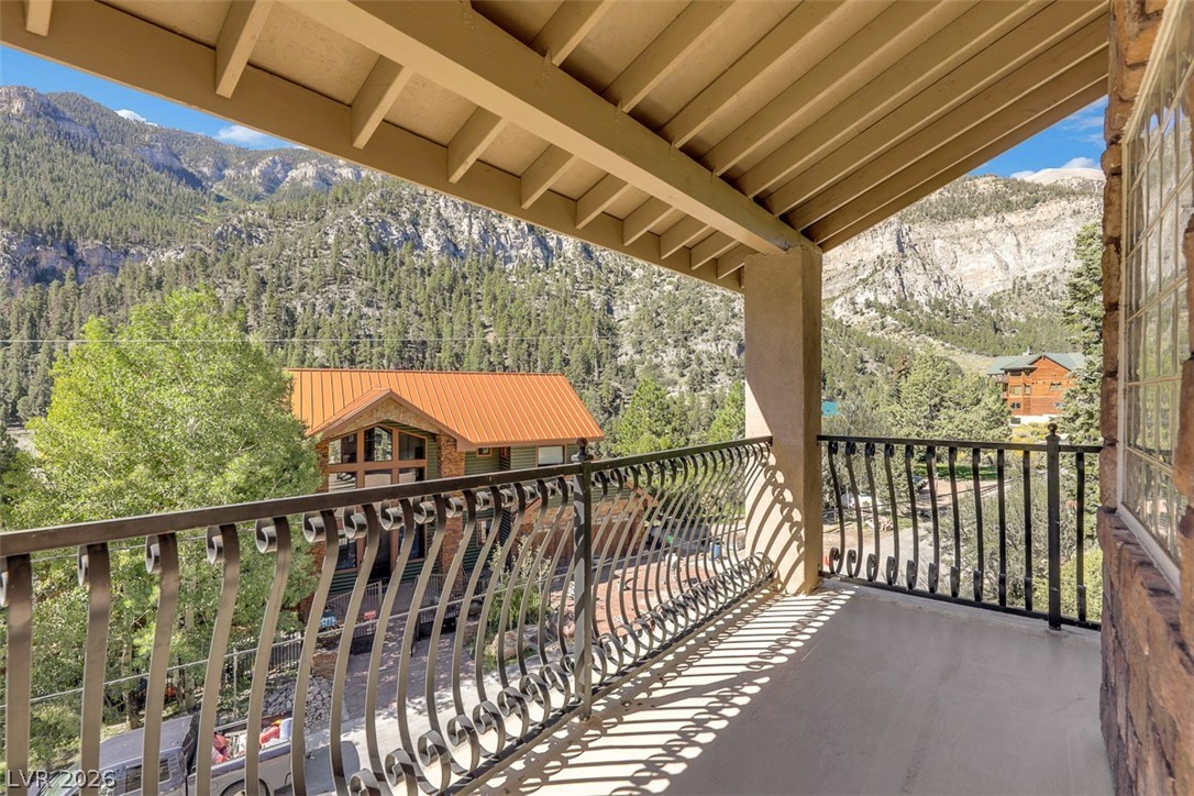 264 Crestview Drive Mount Charleston, NV 89124 - Photo 62 of 78 This outdoor space provides tranquil views of the mountains and lush tree-filled landscape.