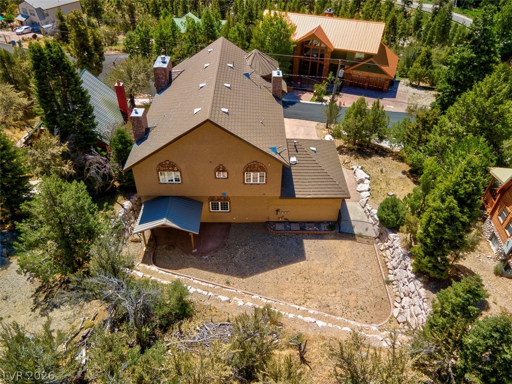 264 Crestview Drive Mount Charleston, NV 89124 - Photo 75 of 78 An aerial perspective reveals a charming residence nestled amidst a verdant landscape.
