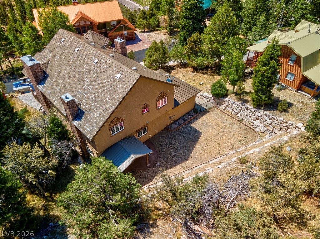 264 Crestview Drive Mount Charleston, NV 89124 - Photo 76 of 78 An aerial perspective reveals the structure nestled amidst a verdant landscape.
