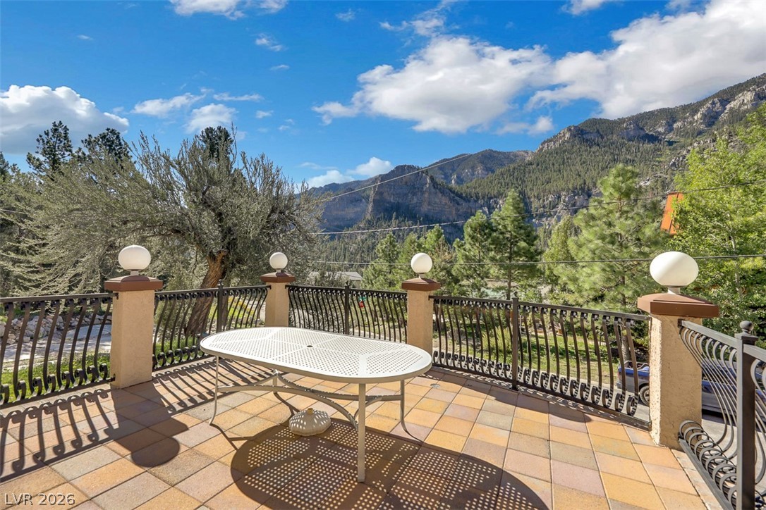 264 Crestview Drive Mount Charleston, NV 89124 - Photo 8 of 78 This inviting patio provides serene mountain views, perfect for peaceful outdoor enjoyment.
