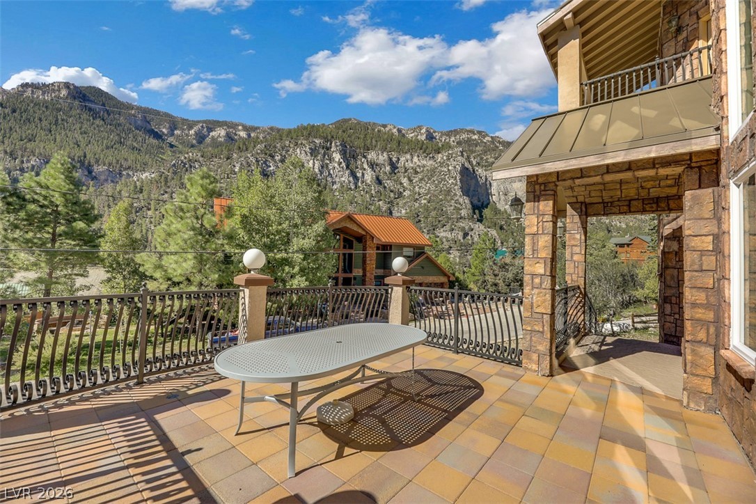 264 Crestview Drive Mount Charleston, NV 89124 - Photo 9 of 78 This outdoor patio provides expansive views of the surrounding mountains and lush landscape.
