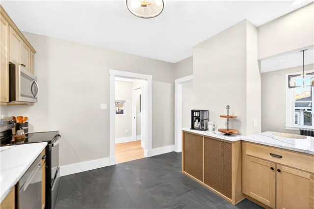 a view of a kitchen with electric appliances