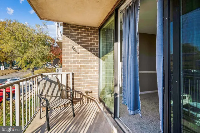 a view of balcony with wooden floor