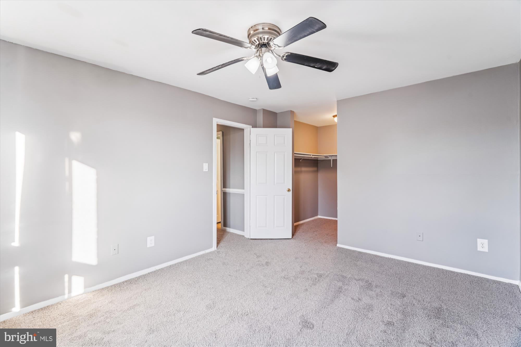 7973 Riggs Road, Unit 8 Hyattsville, MD 20783 - Photo 18 of 45 a view of an empty room with a ceiling fan