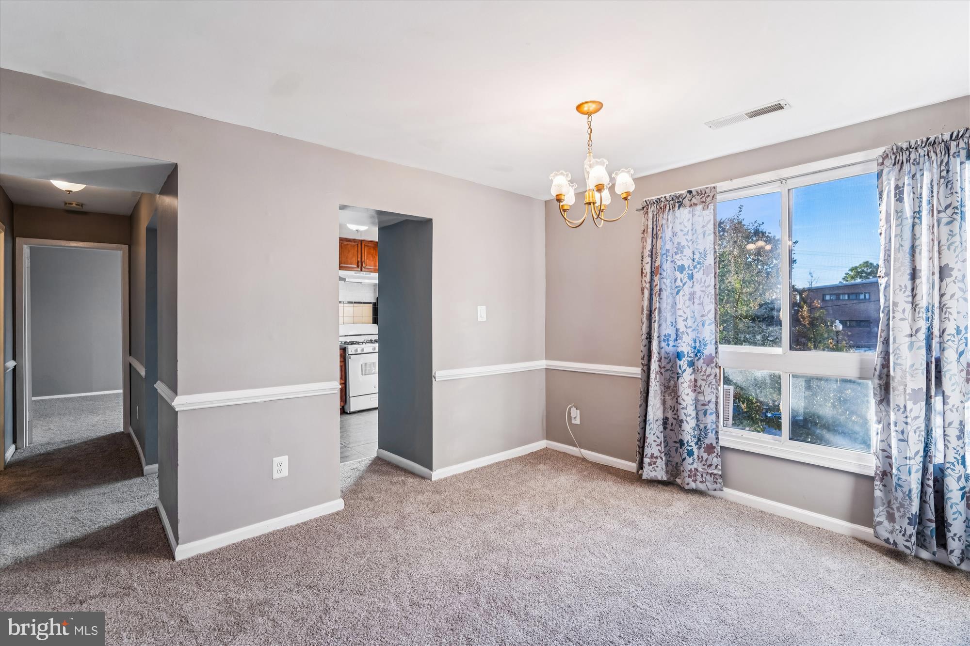 7973 Riggs Road, Unit 8 Hyattsville, MD 20783 - Photo 25 of 45 an empty room with windows and entryway