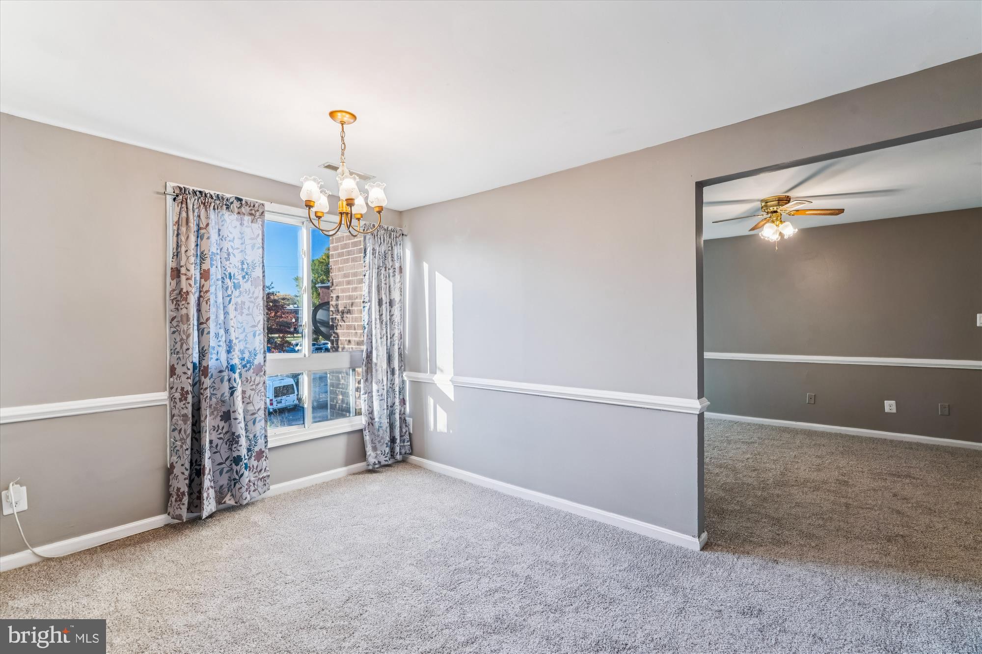7973 Riggs Road, Unit 8 Hyattsville, MD 20783 - Photo 27 of 45 an empty room with chandelier fan and entrance