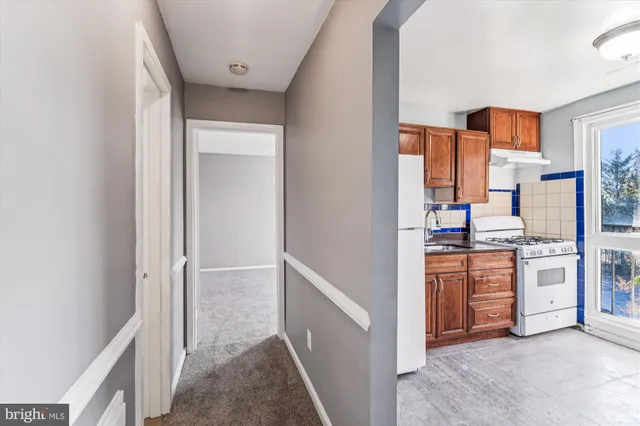 a kitchen with stainless steel appliances a refrigerator and a stove