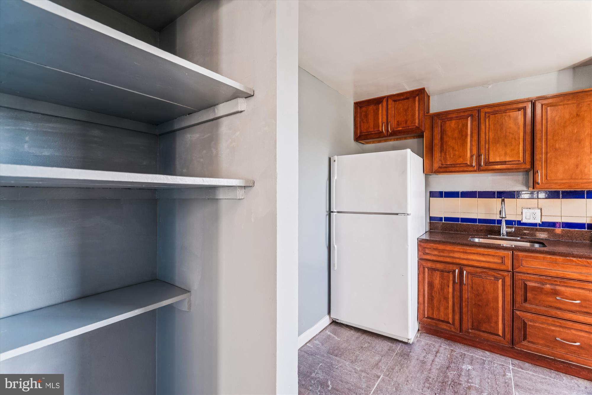 7973 Riggs Road, Unit 8 Hyattsville, MD 20783 - Photo 42 of 45 a kitchen with stainless steel appliances a refrigerator and a stove top oven