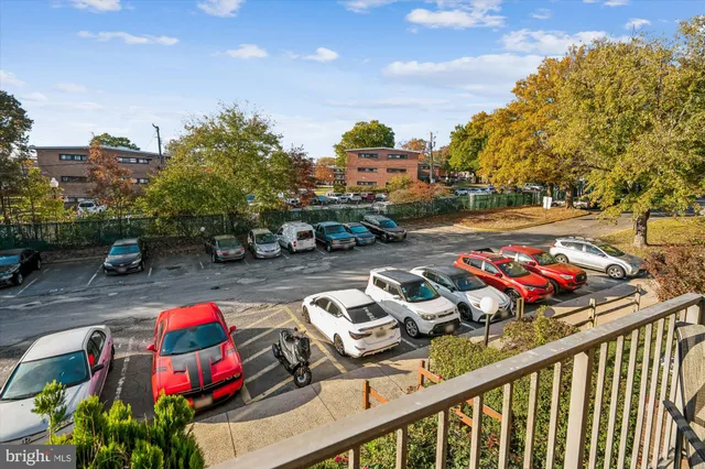 a view of a street with cars on the road