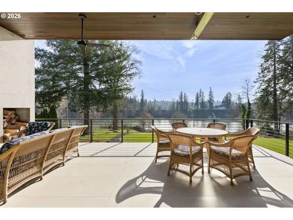a view of a terrace with furniture and a yard