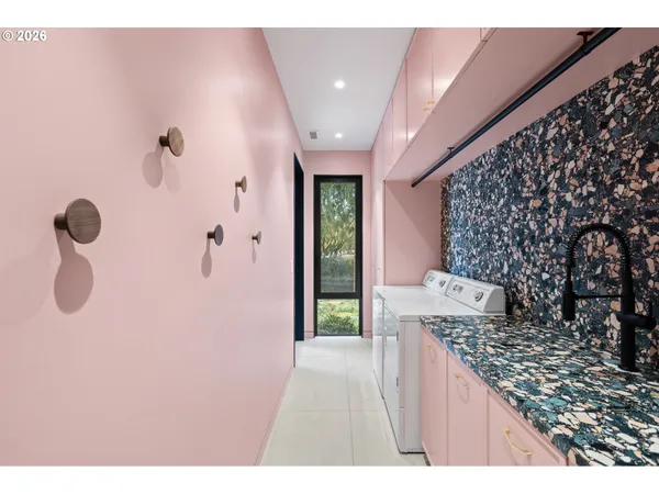 a bathroom with a granite countertop sink a toilet and shower