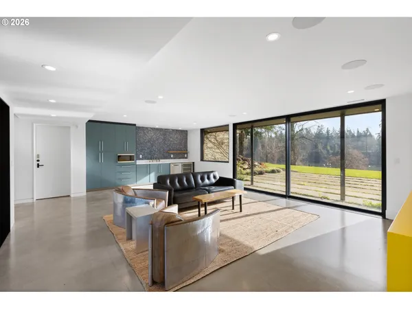 a living room with furniture and a large window