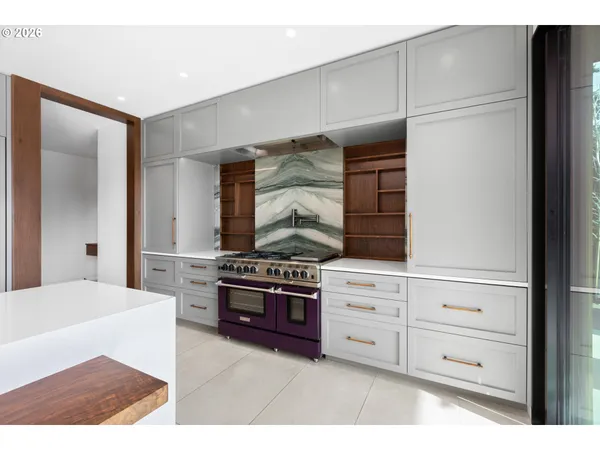a kitchen with stainless steel appliances cabinets and a refrigerator
