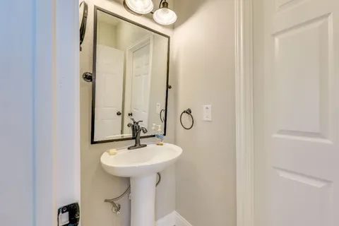a bathroom with a sink and mirror