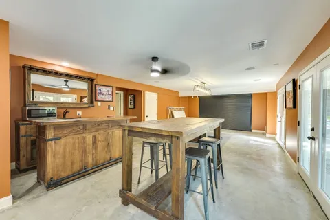 a view of a kitchen with furniture and a window