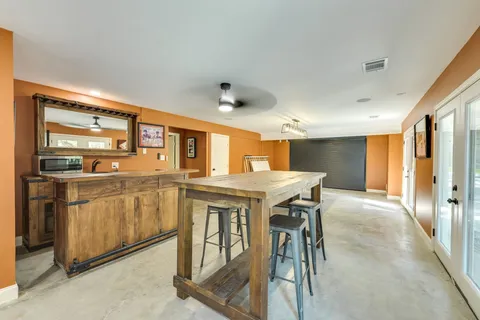 a open kitchen with a sink and refrigerator