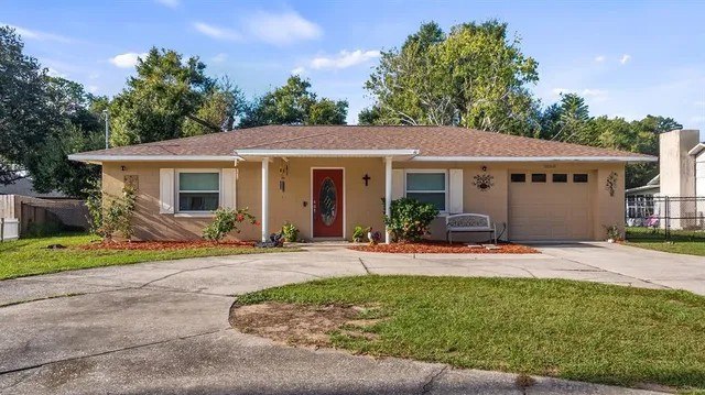 a front view of a house with garden and porch