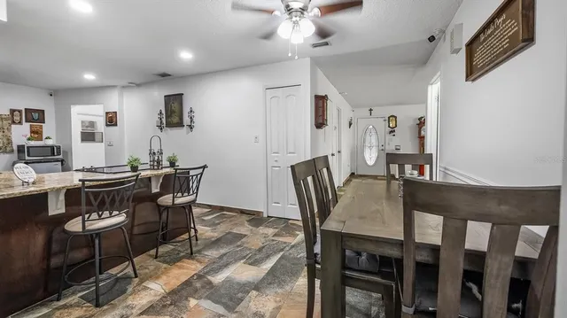 a view of a dining room with furniture