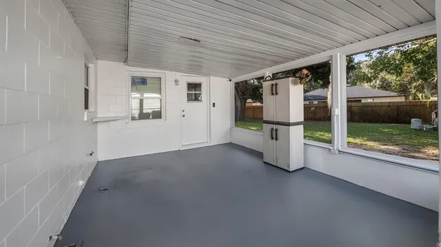 an empty room with balcony