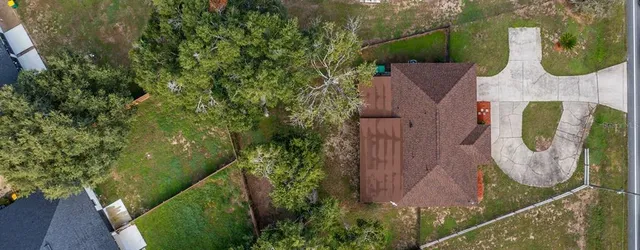 a view of a chair and table in the garden