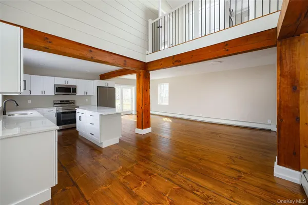 a view of entryway with wooden floor