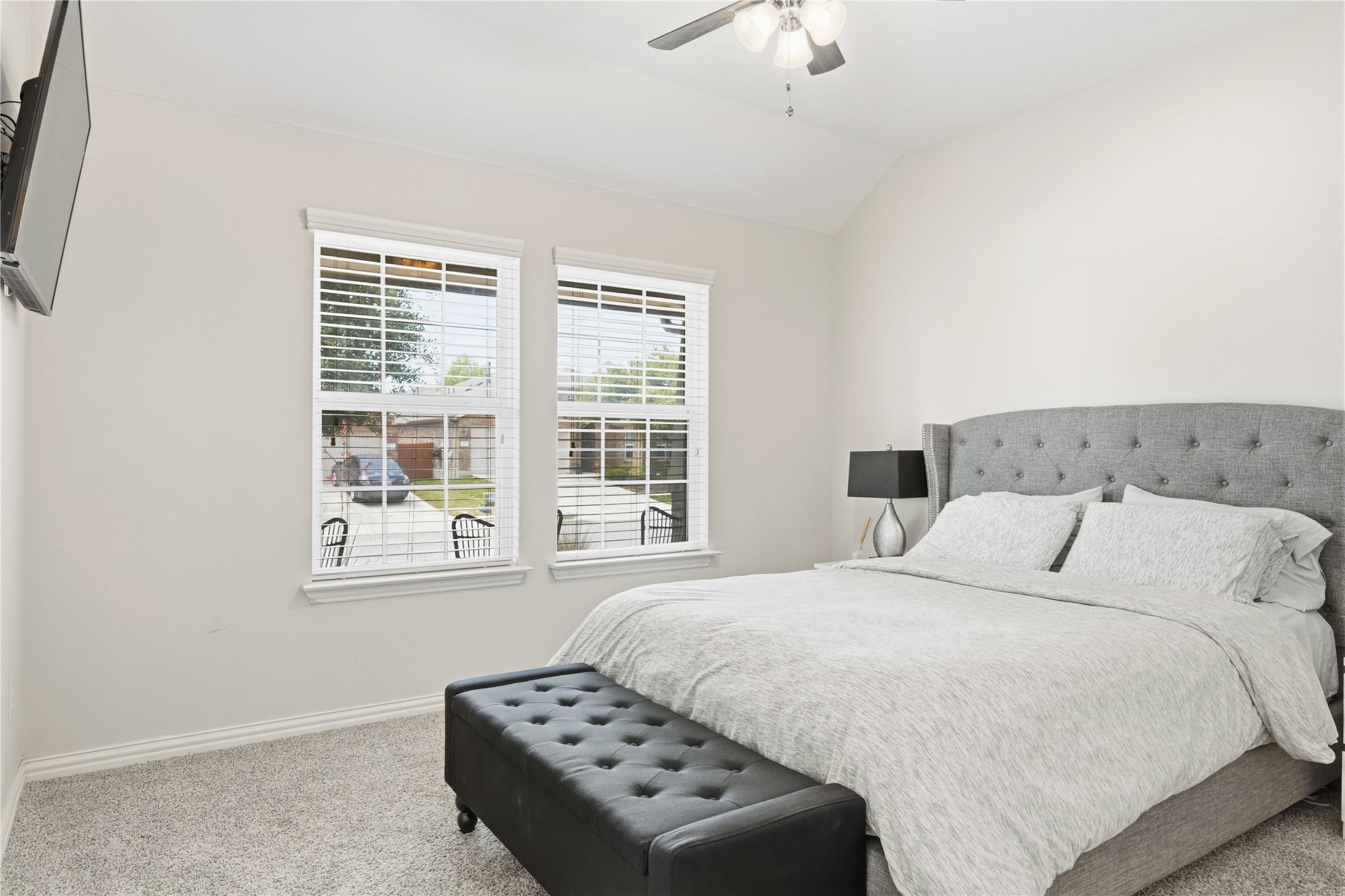486 Pond View Pass Buda, TX 78610 - Photo 23 of 39 Carpeted sleeping area with two windows featuring horizontal blinds