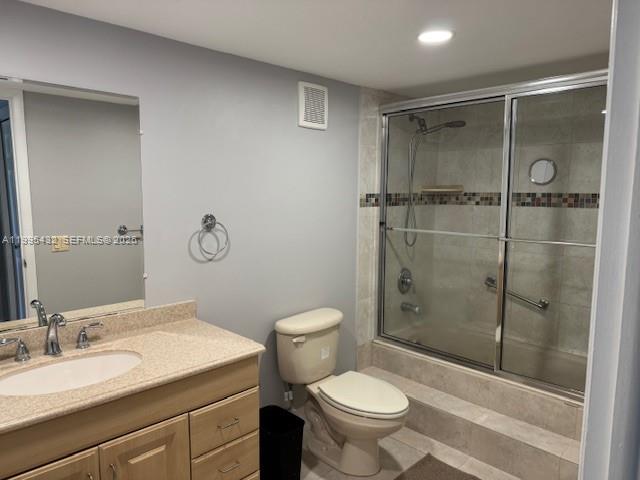 16300 Golf Club Road, Unit 208 Weston, FL 33326 - Photo 14 of 24 a bathroom with a granite countertop sink toilet and shower