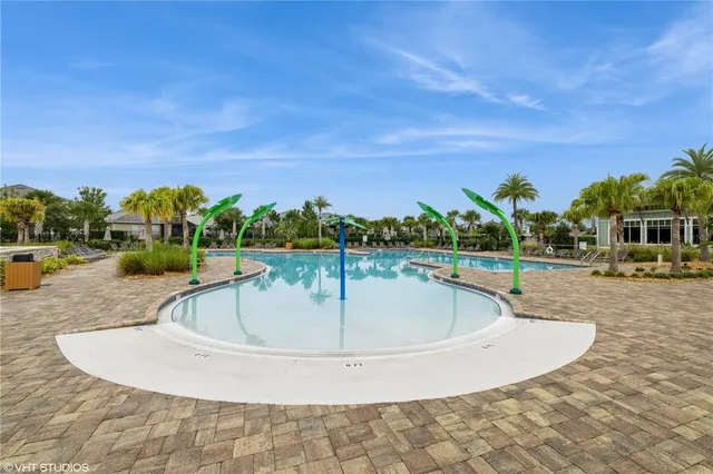 a view of a swimming pool with a house