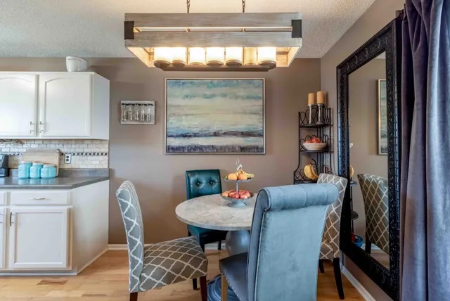 a view of a dining room with furniture and window
