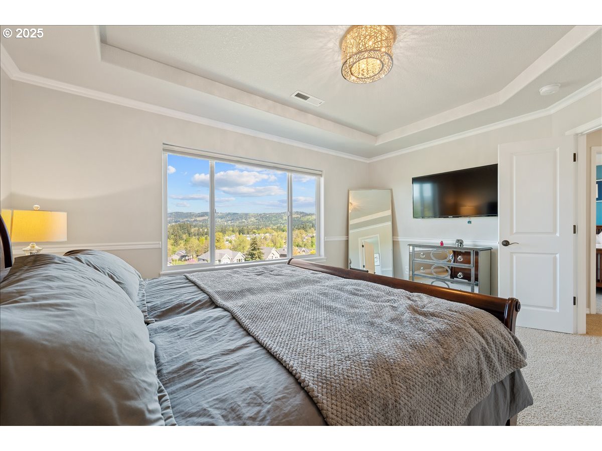 5254 Wedgewood Loop Newberg, OR 97132 - Photo 22 of 43 a bedroom with a bed and a tv