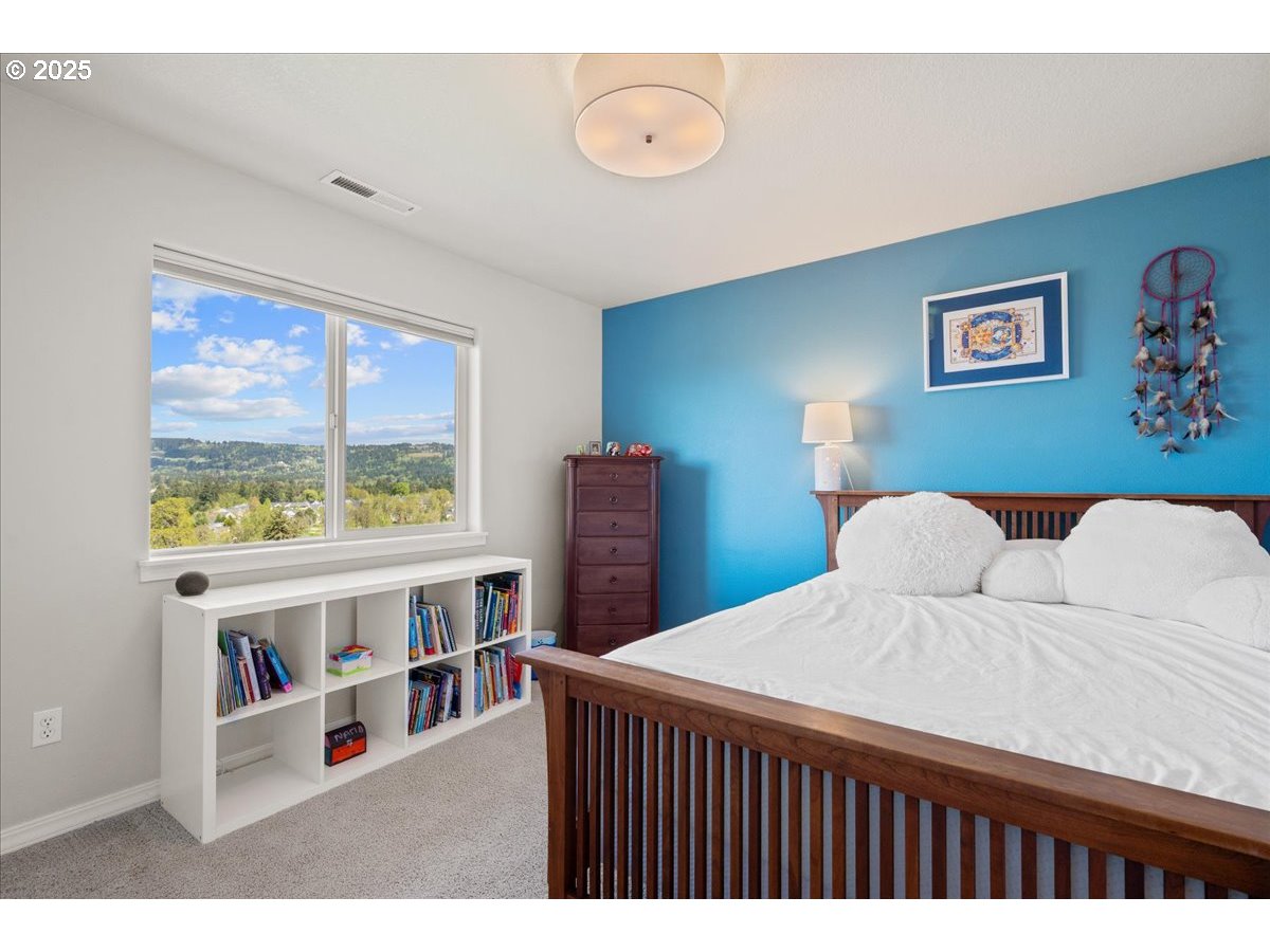 5254 Wedgewood Loop Newberg, OR 97132 - Photo 27 of 43 a living room with a bed furniture and a large window