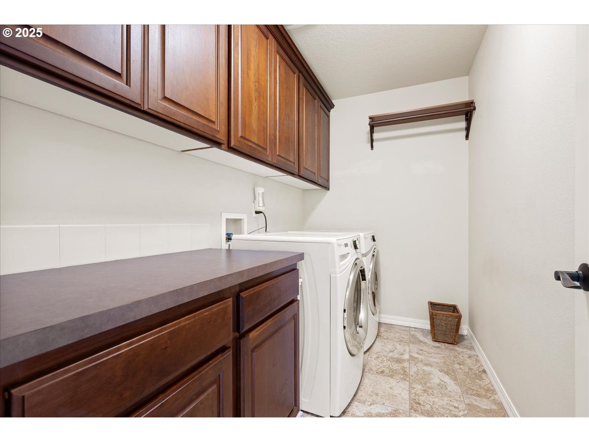 5254 Wedgewood Loop Newberg, OR 97132 - Photo 29 of 43 a utility room with sink dryer and washer