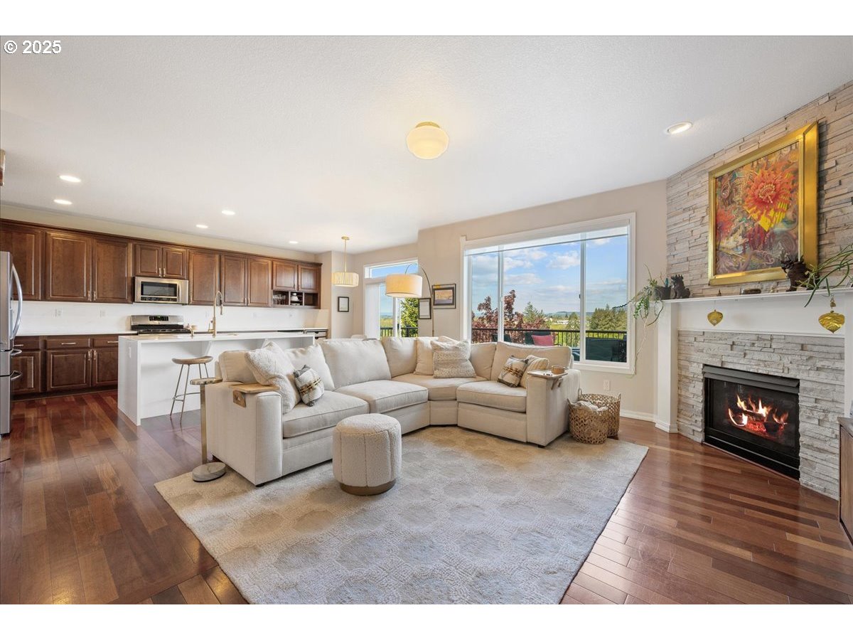 5254 Wedgewood Loop Newberg, OR 97132 - Photo 6 of 43 a living room with furniture and a fireplace