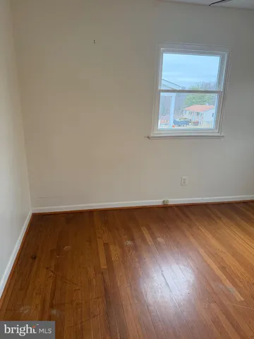 a view of an empty room with a closet
