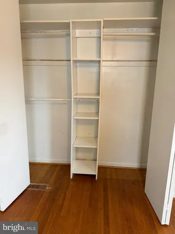 a bathroom with a toilet and a shower curtain