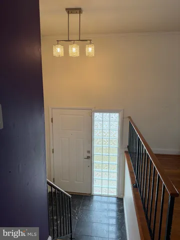 a view of a room with stairs and a sink