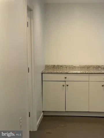 a view of dining room with table and chairs