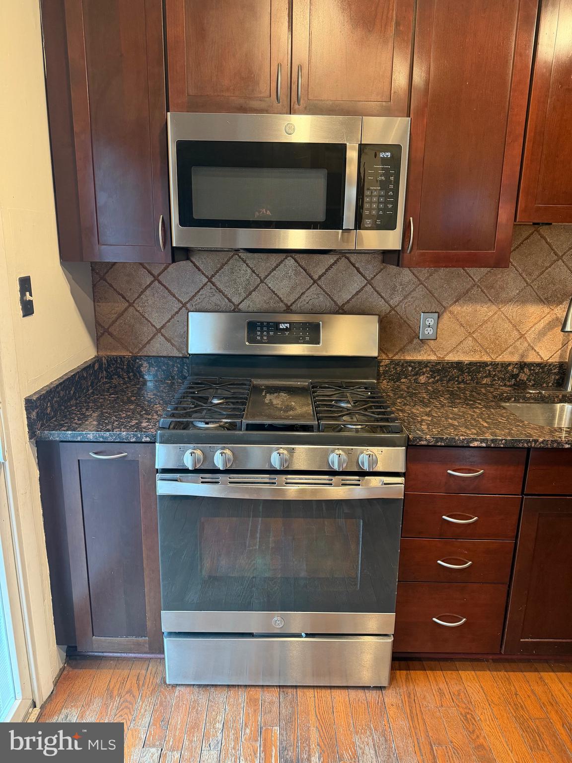 6731 Fox Meadow Road Gwynn Oak, MD 21207 - Photo 9 of 62 Microwave over Stove