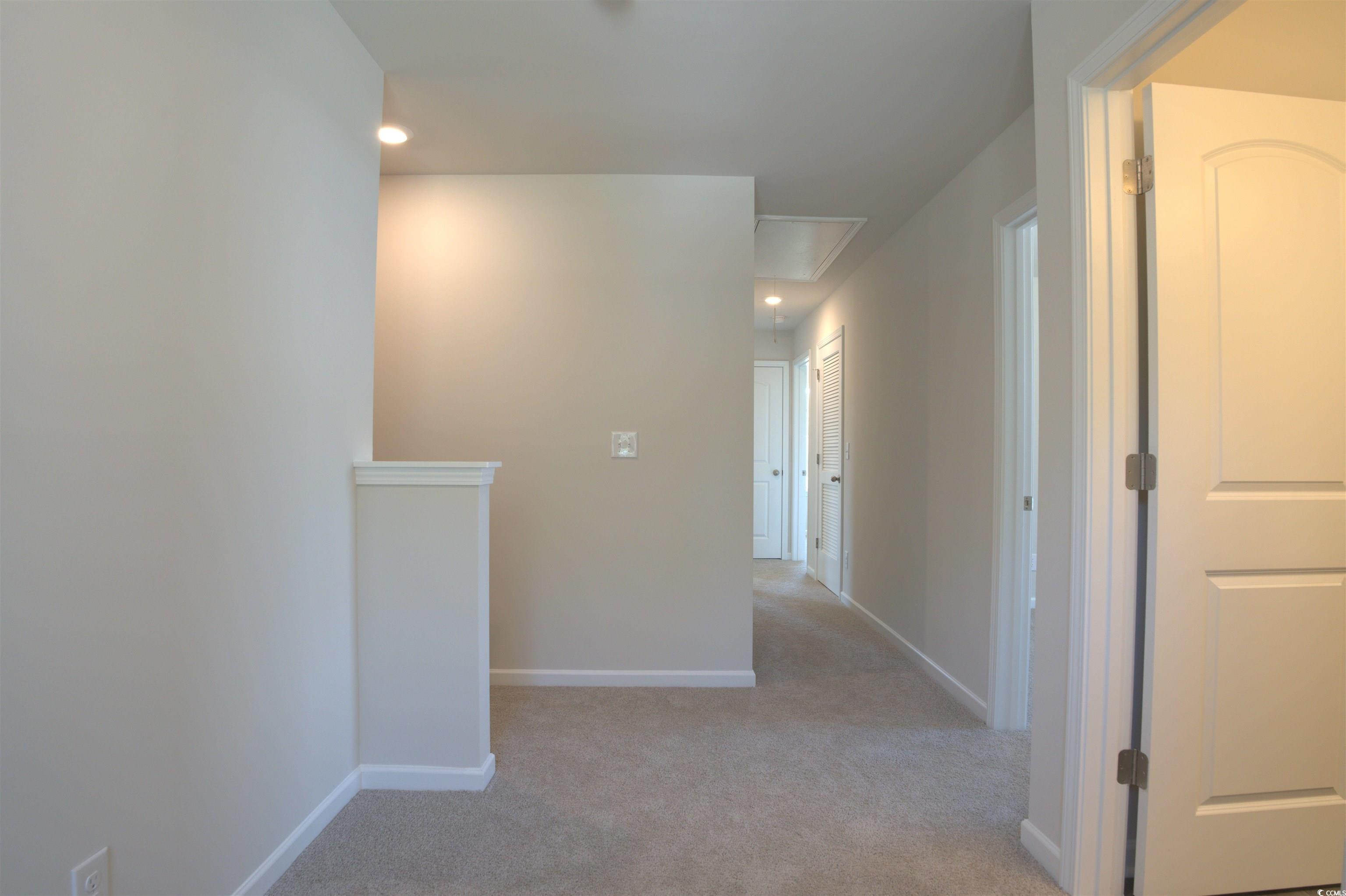 205 Kc Lane Aynor, SC 29511 - Photo 27 of 28 Unfurnished bedroom featuring carpet flooring and baseboards
