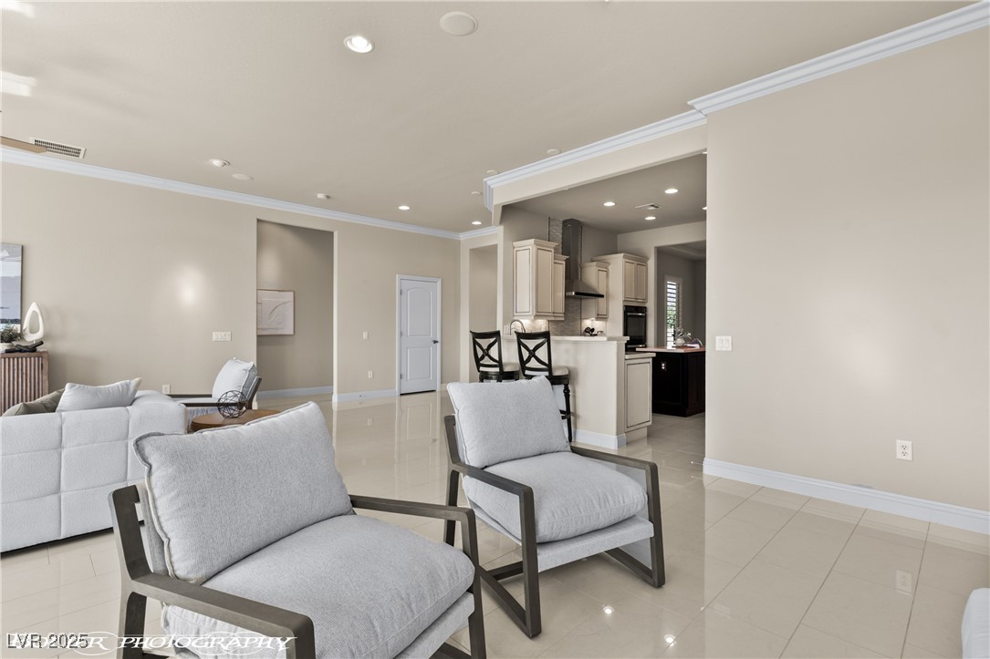1348 Basin View Mesquite, NV 89034 - Photo 11 of 70 Living area featuring ornamental molding, recessed lighting, and light tile patterned floors