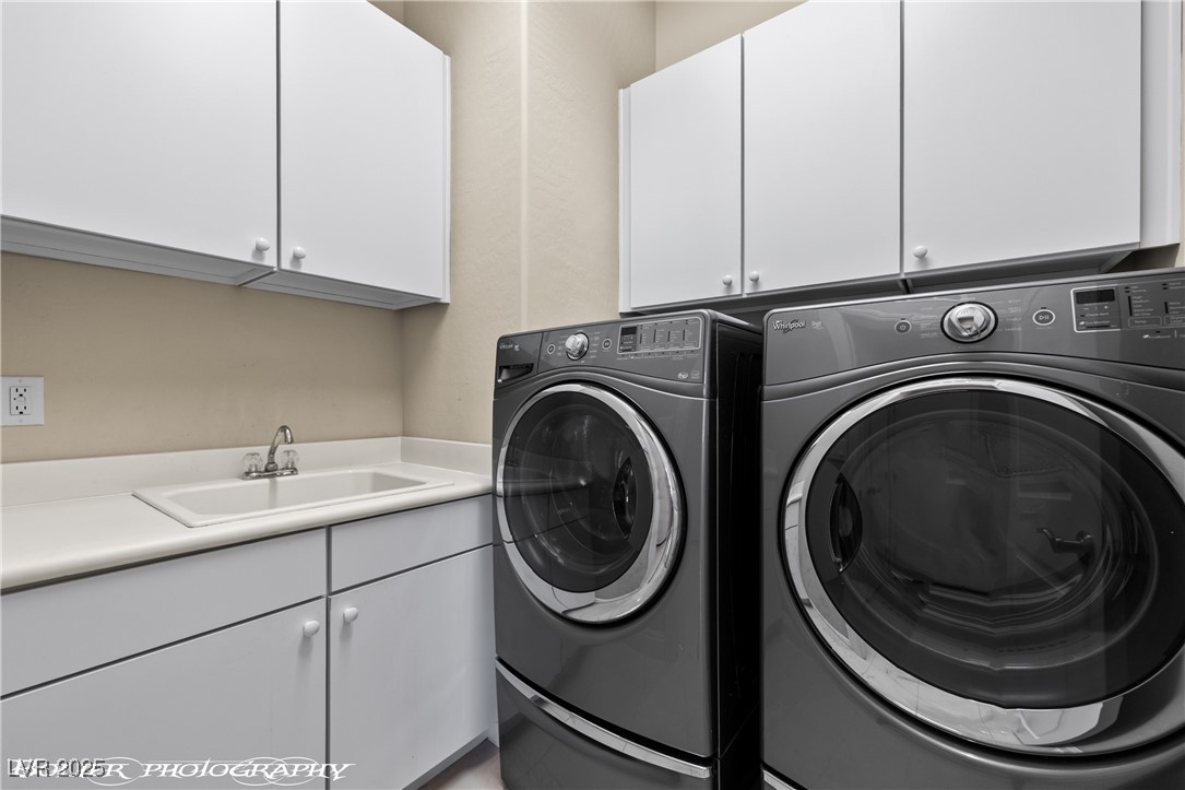 1348 Basin View Mesquite, NV 89034 - Photo 27 of 70 Laundry room featuring cabinet space and independent washer and dryer