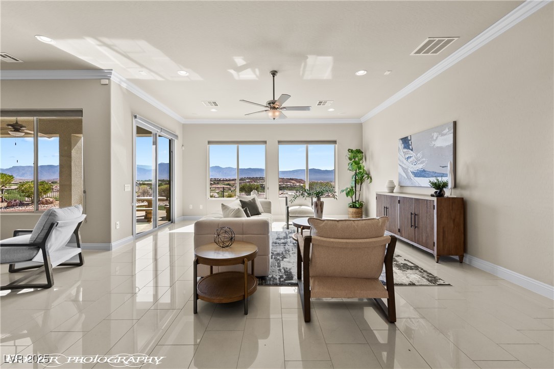 1348 Basin View Mesquite, NV 89034 - Photo 3 of 70 Living room with ornamental molding, a mountain view, recessed lighting, ceiling fan, and light tile patterned floors