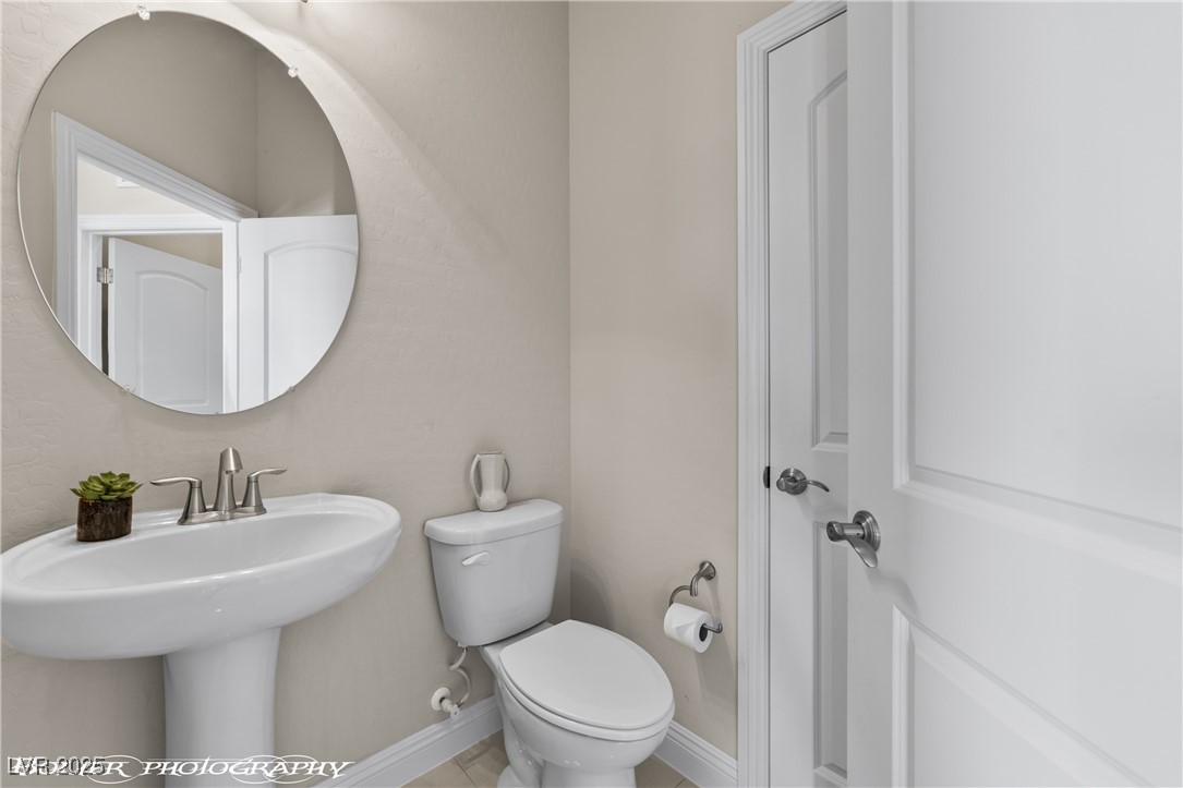 1348 Basin View Mesquite, NV 89034 - Photo 33 of 70 Half bathroom featuring toilet and baseboards