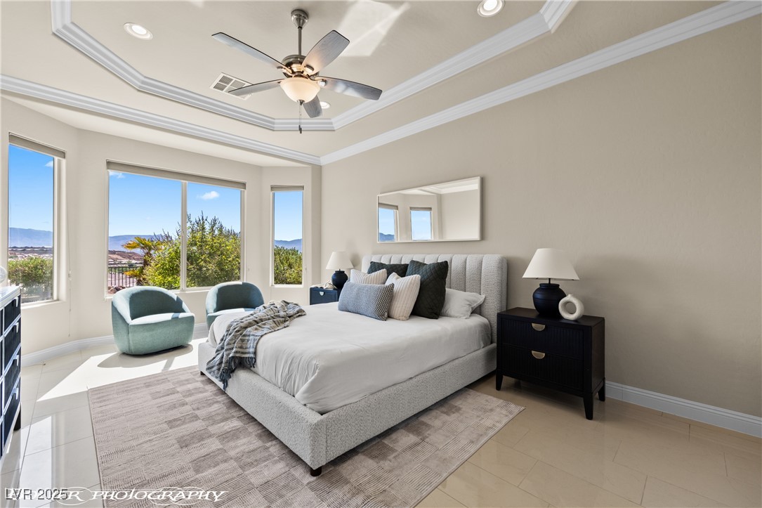 1348 Basin View Mesquite, NV 89034 - Photo 34 of 70 Bedroom with a tray ceiling, ceiling fan, ornamental molding, light tile patterned flooring, and recessed lighting
