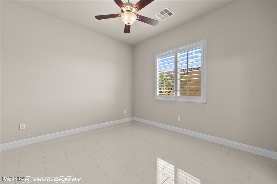 1348 Basin View Mesquite, NV 89034 - Photo 42 of 70 Empty room featuring ceiling fan and light tile patterned flooring